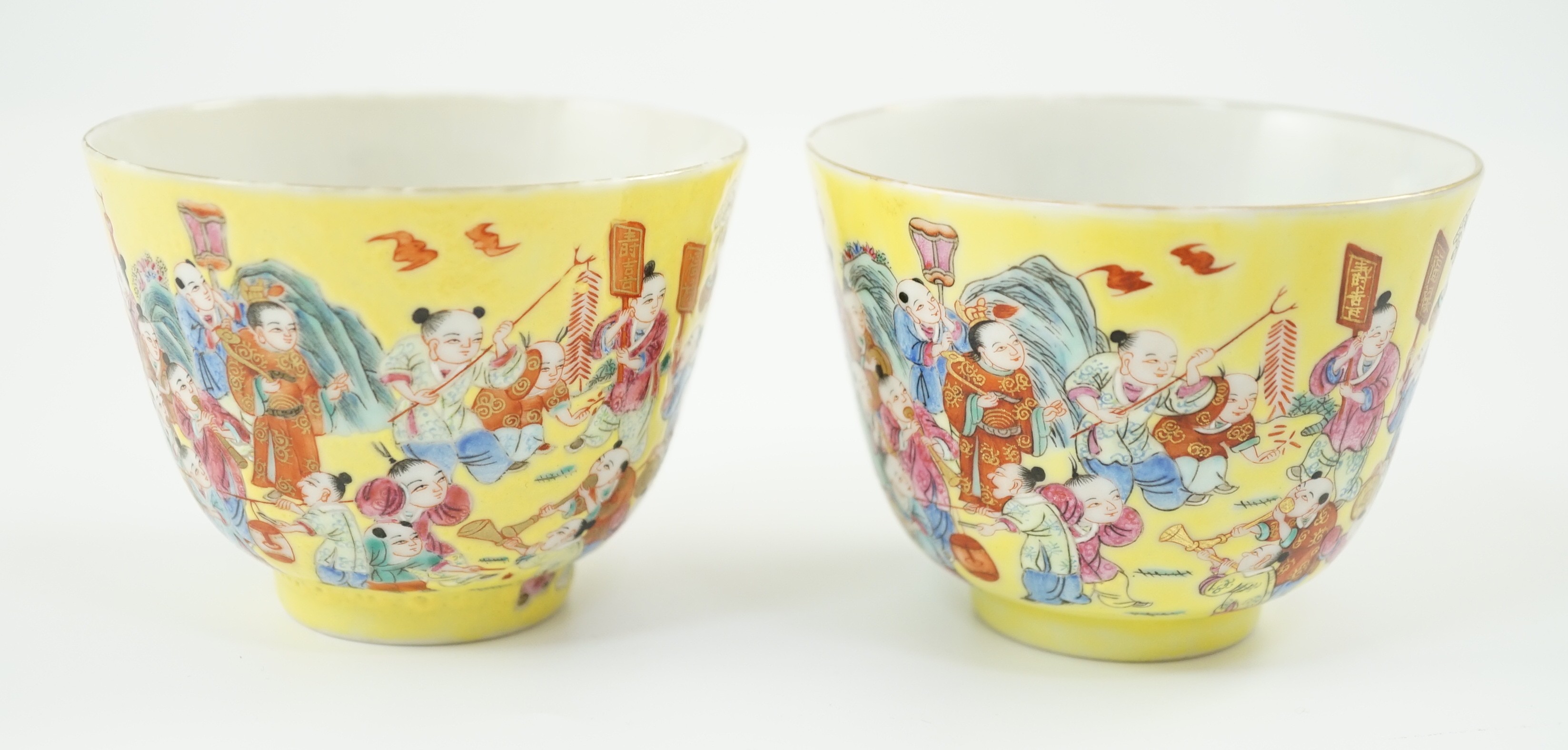 A pair of Chinese yellow ground 'Hundred Boys’ cups, 19th century, 6.5cm high 8.5cm diameter